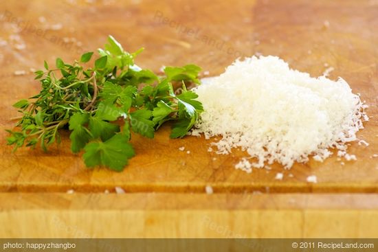 While the bread crumbs are baking, grate some parmesan and chop some fresh thyme leaves and parsley...