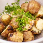 Toss the hot grilled potatoes...