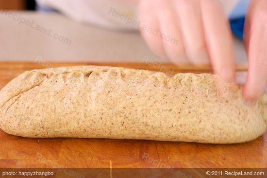 Turn the dough seam side up and pinch it closed.