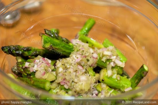 Pour remaining vinaigrette over the pan-seared asparagus.