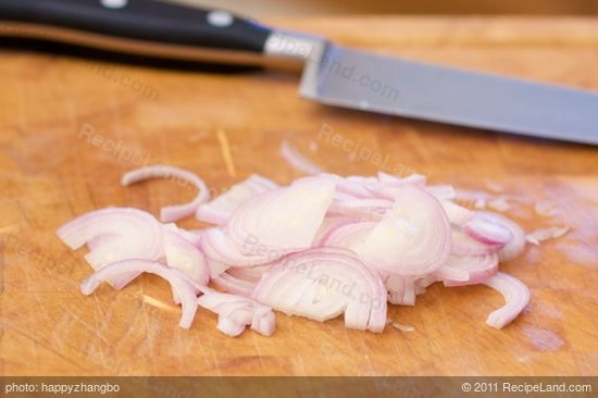 Meanwhile thinly slice the shallots or red onion.