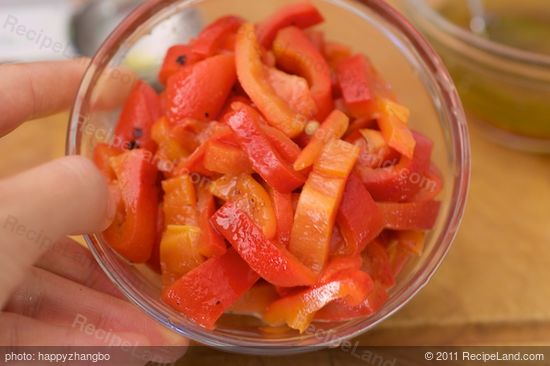 Slice the roasted bell peppers.