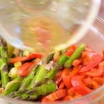 Pour the remaining dressing over the asparagus and roasted bell pepper.