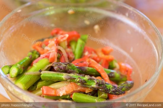 Toss until well coated, then place over the spinach.