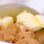Combine the softened butter and the peanut butter in a large bowl.
