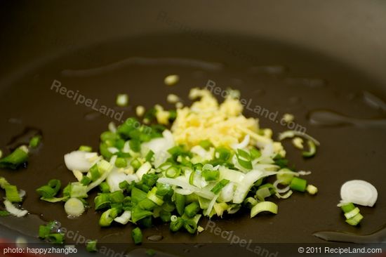 Heat 1 teaspoon of oil in a large nonstick skillet until hot. Add half of each scallions, gingers and garlic.