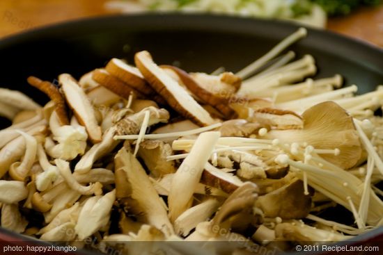 Stir in the prepared assorted mushrooms.