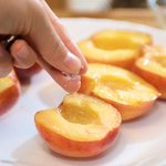 Sprinkle some sea salt or table salt over the peaches.
