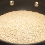 Add quinoa in a dry skillet over medium heat.