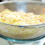 Transfer the slaw into a colander that sits over a large bowl or saucepan.