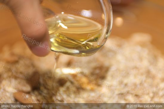 Pour the oil into the well mixed dry ingredients.