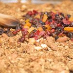 Add half of the dried fruits into each baking sheet.