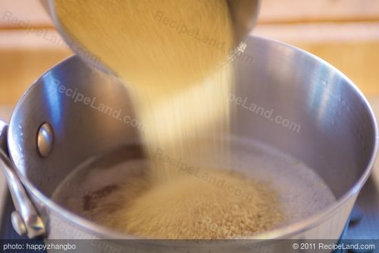 Add the couscous into the boiling vegetable stock.