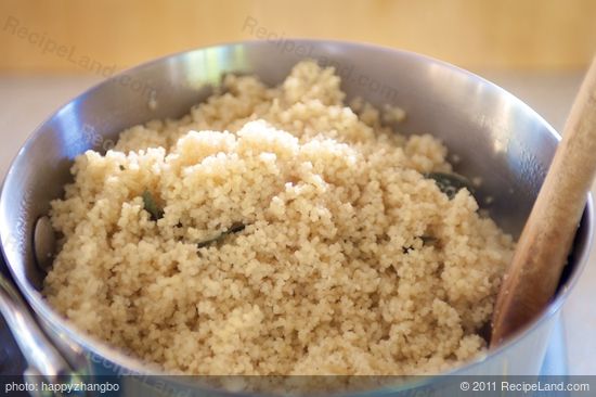 After 5 minutes, fluff the couscous with a fork.