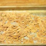 Toast the almonds in a toaster oven at 350 F degrees for 10 minutes.