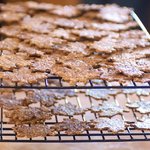 With a cookie lifter, transfer the crackers onto wire racks, and let cool completely.