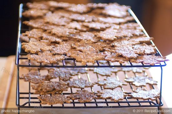 With a cookie lifter, transfer the crackers onto wire racks, and let cool completely.