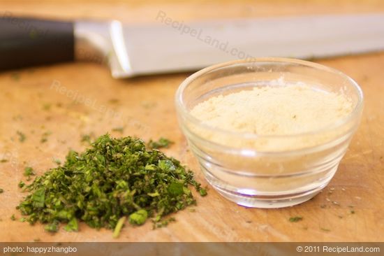 Finely chop the mixed herbs, and place 1 tablespoon of each garlic and onion powder into a small bowl.