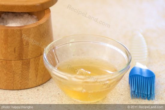 While the crackers are baking, mix together the honey and water to make the glaze.