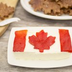 The finished cheese flag with maple leaf crackers