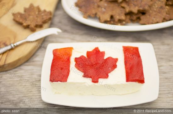 The finished cheese flag with maple leaf crackers