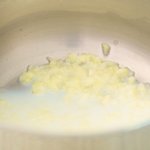 Poach the garlic in some milk