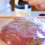 Season the flank steak with salt and pepper