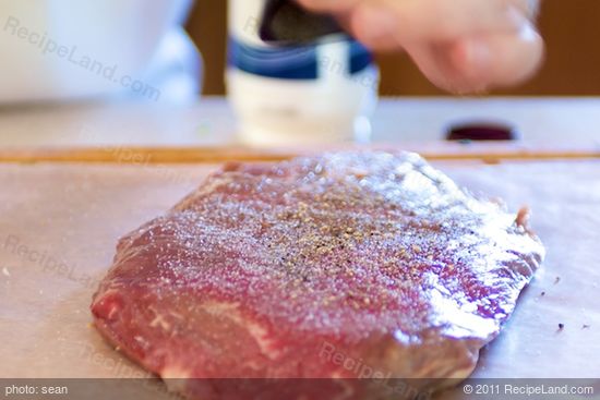 Season the flank steak with salt and pepper