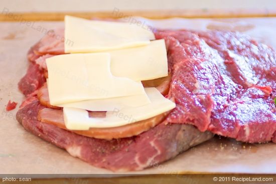Add a layer of cheese on top of the ham