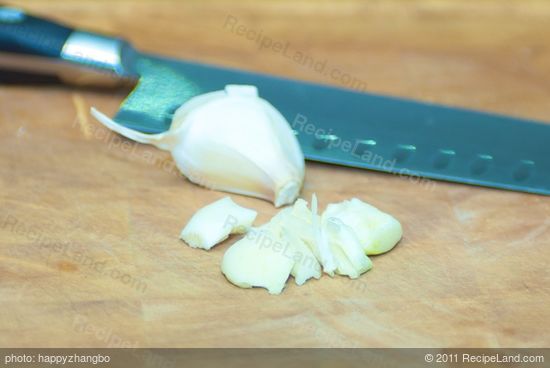 Peel and chop the garlic.