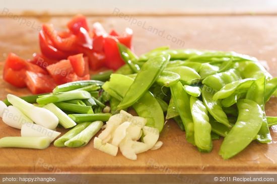 Meanwhile prepare the green onions, red pepper and garlic.