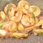 Then add the sauce and allow to poach for about two minutes until the sauce has thickened is more sticky and coats the shrimp.