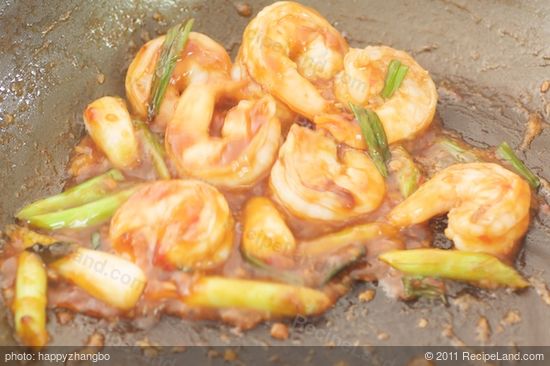 Then add the sauce and allow to poach for about two minutes until the sauce has thickened is more sticky and coats the shrimp.