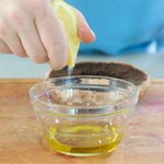 Add the olive oil into a small bowl, squeeze some fresh lemon juice.