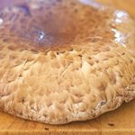 With a sharp knife, cut 1/4-inch slits, spaced 1/2-inch apart, in the crosshatch patten on the surface of 8 mushrooms.