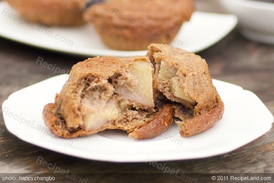 Tear the muffin into the half, and now we can see the beautiful chunks of apples and blueberries.