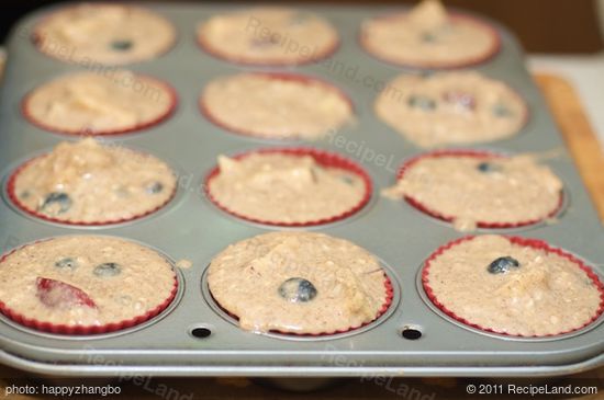 Spoon the batter into prepared muffin pan.