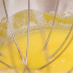 Beat the egg yolks in a bowl with an electric mixer until just mixed.