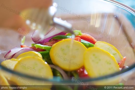 Put all the chopped veggies into a large mixing bowl, drizzle some olive oil.