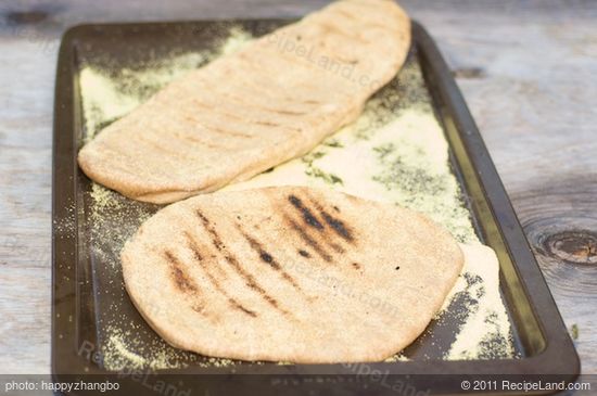 Using tongs transfer the crust to a baking sheet. Close the lid.  