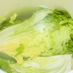 Arrange the cabbage halves facing up and press them down so the water will go through each layer. 