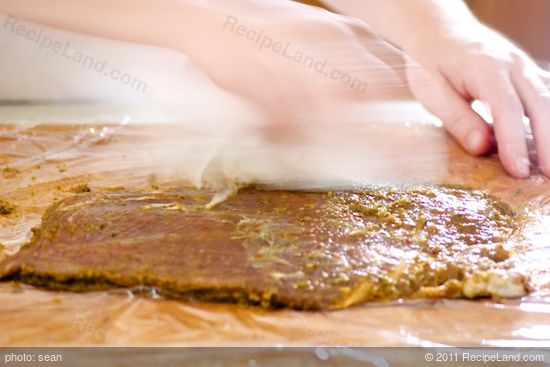 Wipe off excess marinade with paper towels