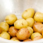 Toss the scrubbed potatoes in some olive oil, salt, pepper