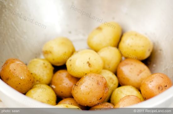 Toss the scrubbed potatoes in some olive oil, salt, pepper