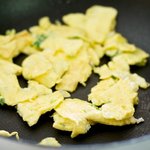 Scramble the eggs with a spatula, breaking into large pieces.