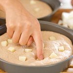 Push the mozzarella cubes into the focaccia dough 