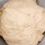 Turn the dough onto a lightly floured cutting board, well grease the mixing bowl with the cooking spray or oil.
