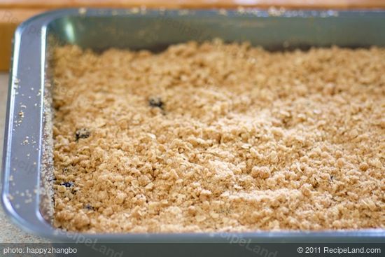 Sprinkle the streusel topping evenly over the blueberries and batter. 