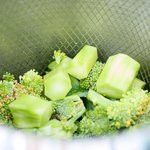 Steam both broccoli florets and peeled stems in a basket over a pot filled with about 1-inch water. 