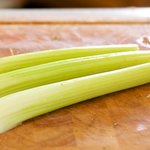 Wash well and trim off the tough ends or tops of the celery.
